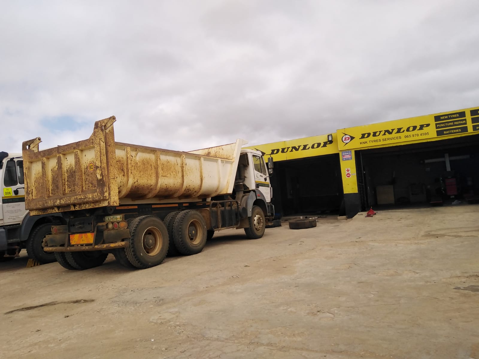 KNK Tyres team providing expert tyre services.